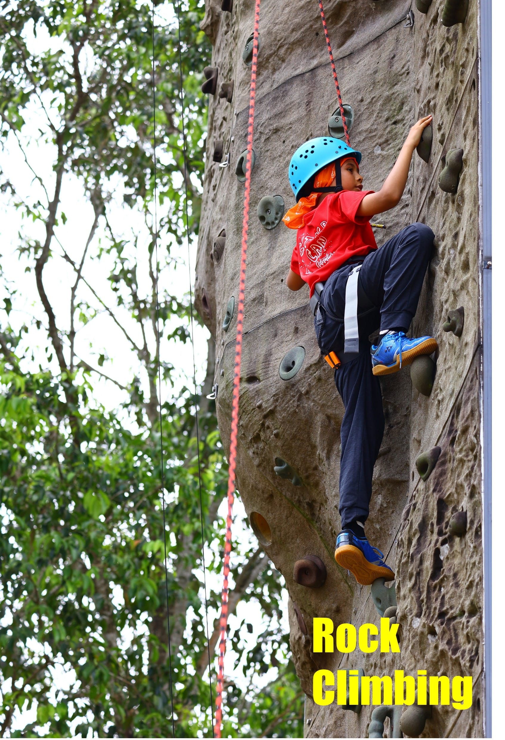A P5 student rock climbing